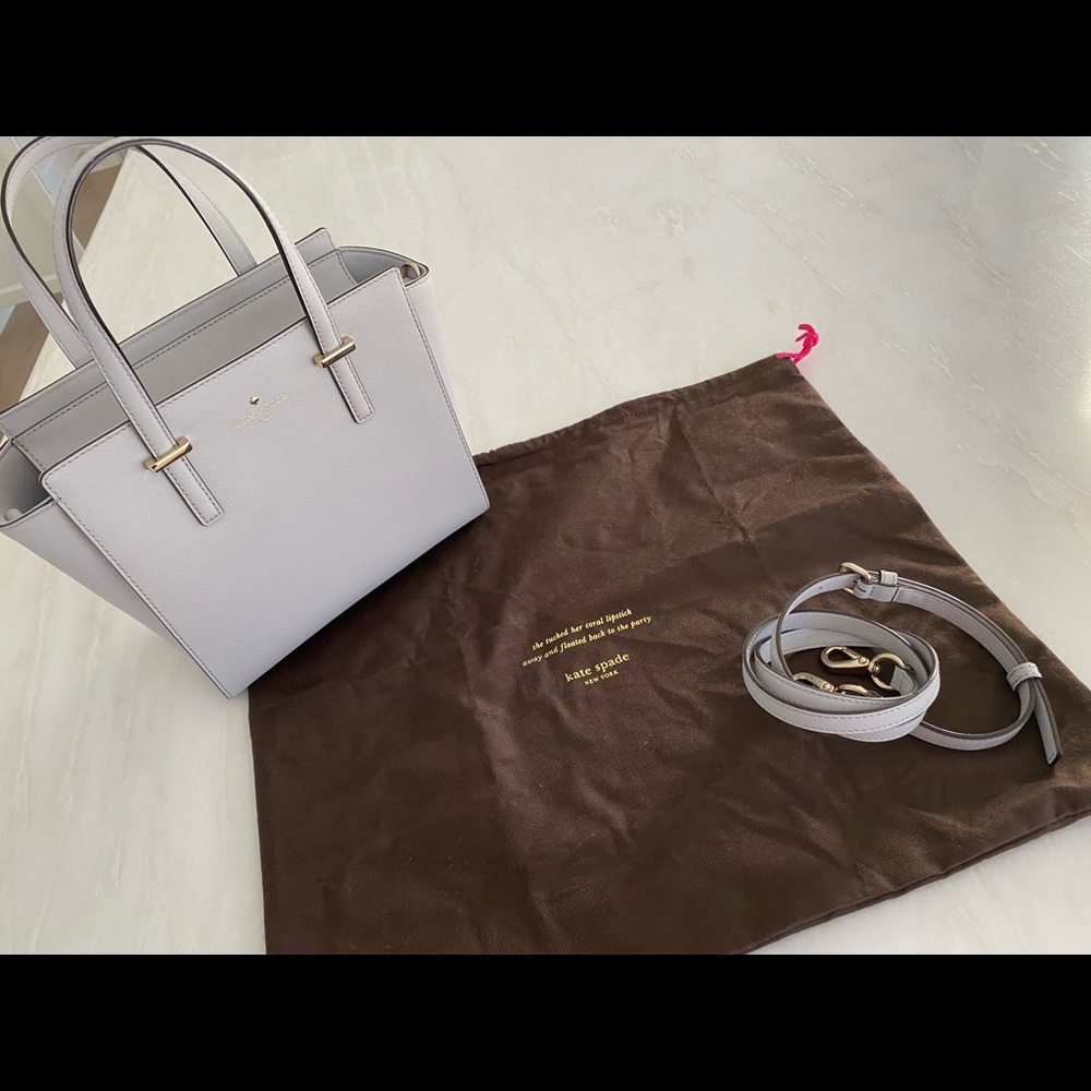 Kate Spade light gray handbag with removable strap and dust bag.